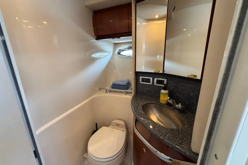 Slide: The Image of Luxurious bathroom in 2003 Sea Ray 420 Sundancer yacht with modern amenities. - 32