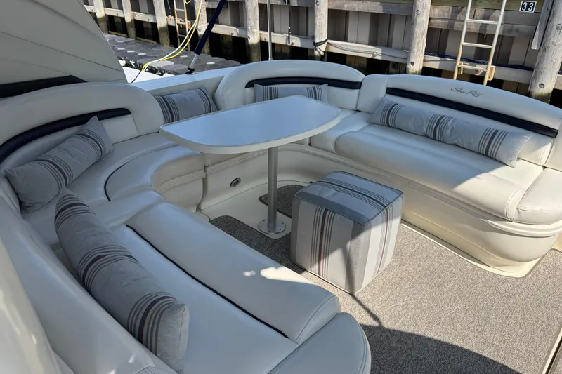 Slide: The Image of Luxurious 2003 Sea Ray 420 Sundancer yacht interior with plush seating and table. - 9