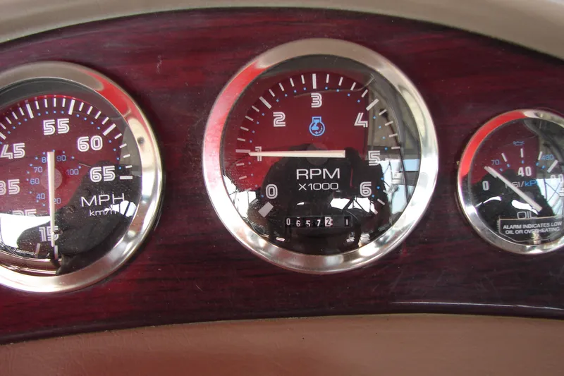 Slide: The Image of Dashboard gauges of a 1999 CHAPPARRAL 233 Sunesta boat, showing speed and RPM. - 19