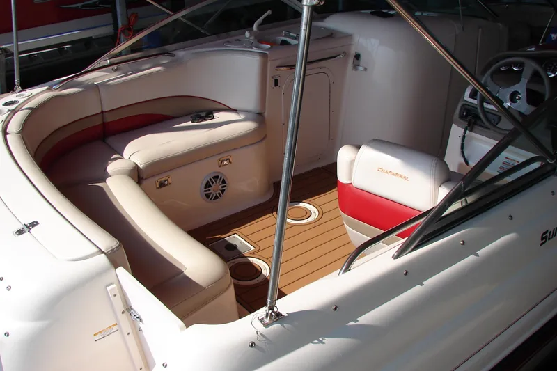 Slide: The Image of 1999 CHAPPARRAL 233 Sunesta boat interior with white and red seating, wood flooring. - 22