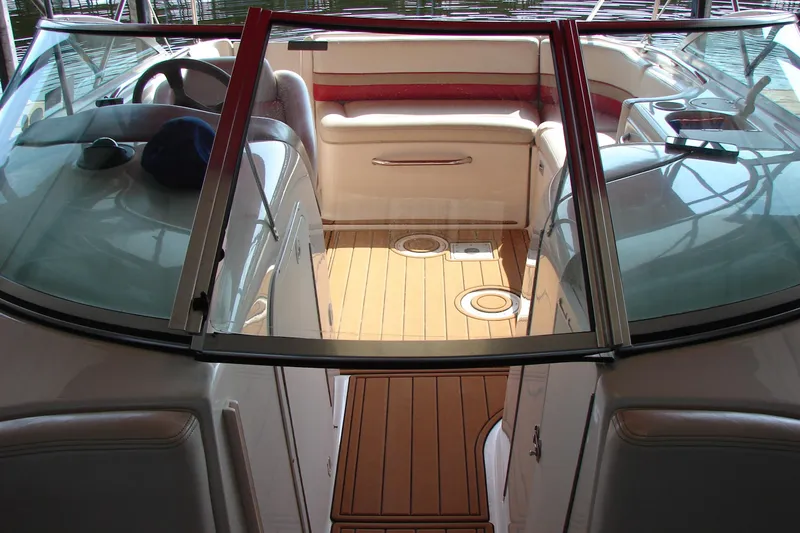 Slide: The Image of 1999 CHAPPARRAL 233 Sunesta boat interior with wood flooring and seating area. - 23