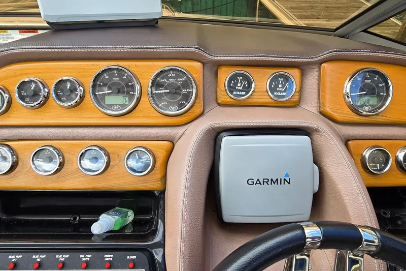 Slide: The Image of Dashboard of a 2011 Cobalt 323 boat with Garmin navigation system. - 17
