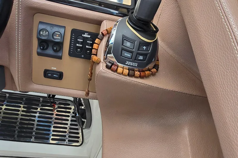 Slide: The Image of 2011 Cobalt 323 boat controls with Volvo Penta joystick and Lenco trim tabs. - 18