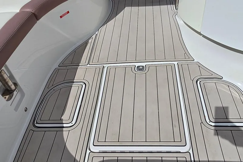 Slide: The Image of Cobalt 323 2011 boat deck with sleek, modern design and brown seating. - 28