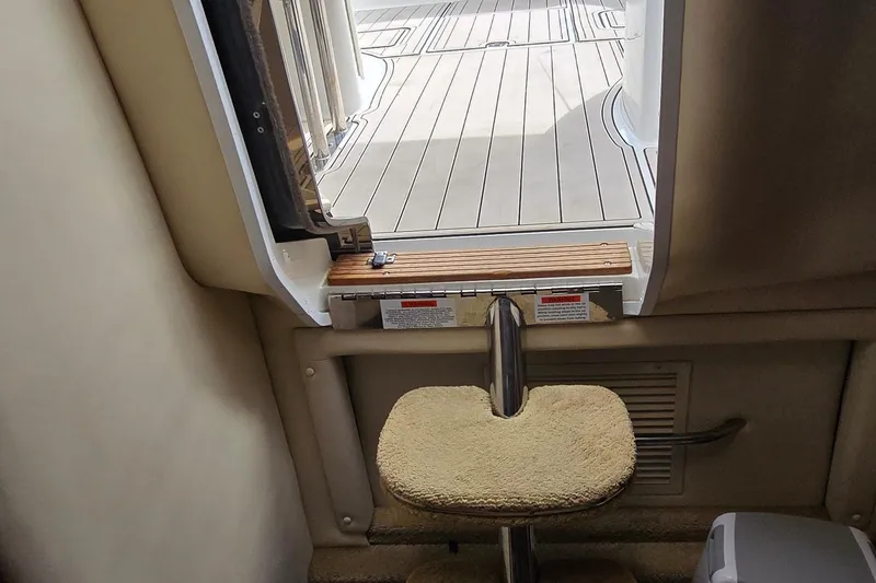 Slide: The Image of Interior view of a 2011 Cobalt 323 boat, showing a step and open hatch. - 39