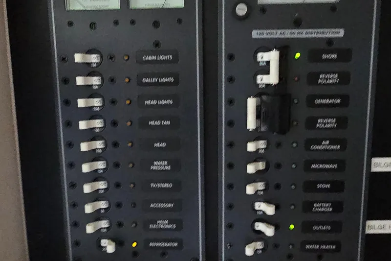 Slide: The Image of Control panel of a 2011 Cobalt 323 boat with labeled switches and indicators. - 40