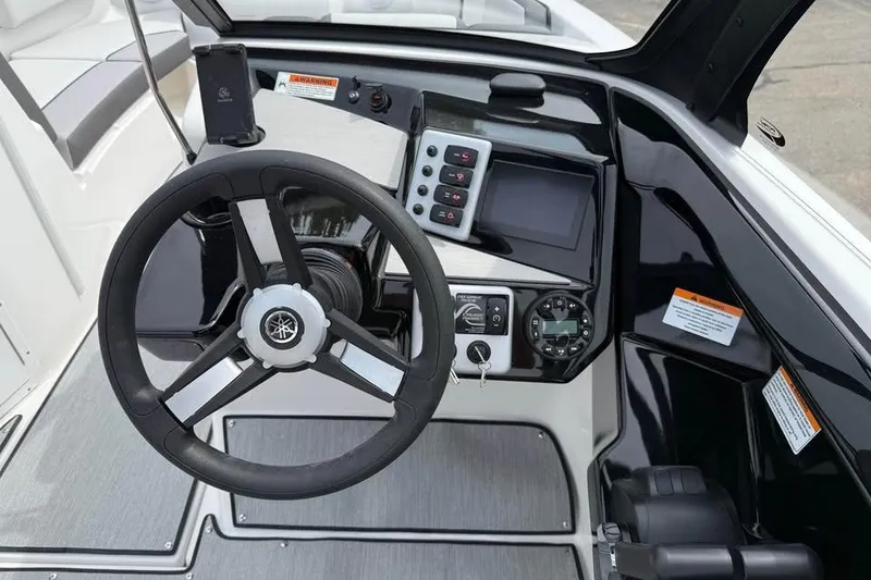 Slide: The Image of 2026 Yamaha Boats AR220 dashboard with steering wheel and control panel. - 10