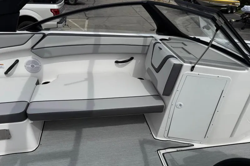 Slide: The Image of 2026 Yamaha Boats AR220 interior seating with gray and white upholstery. - 11
