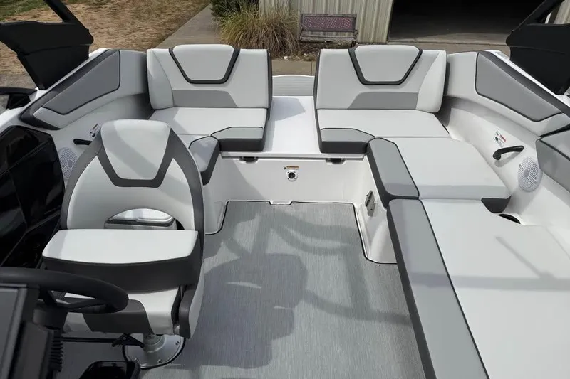 Slide: The Image of 2026 Yamaha Boats AR220 interior with modern seating and sleek design. - 13