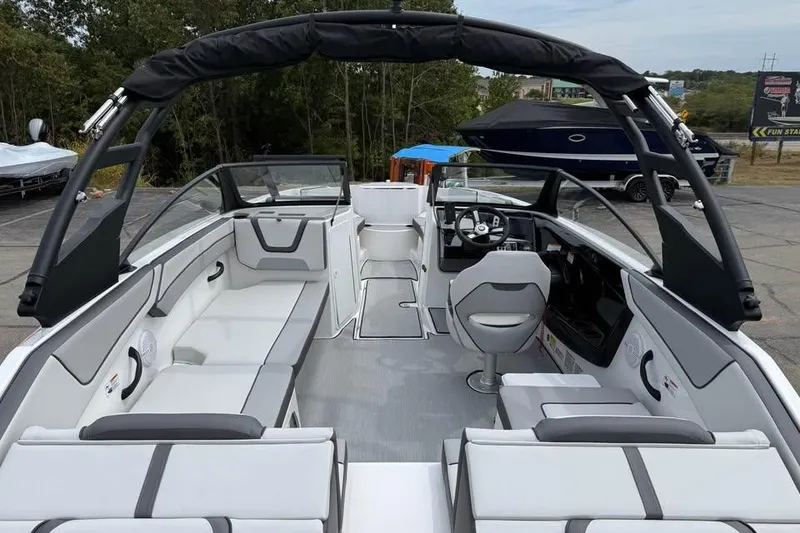 Slide: The Image of 2026 Yamaha Boats AR220 interior with sleek seating and modern dashboard design. - 6