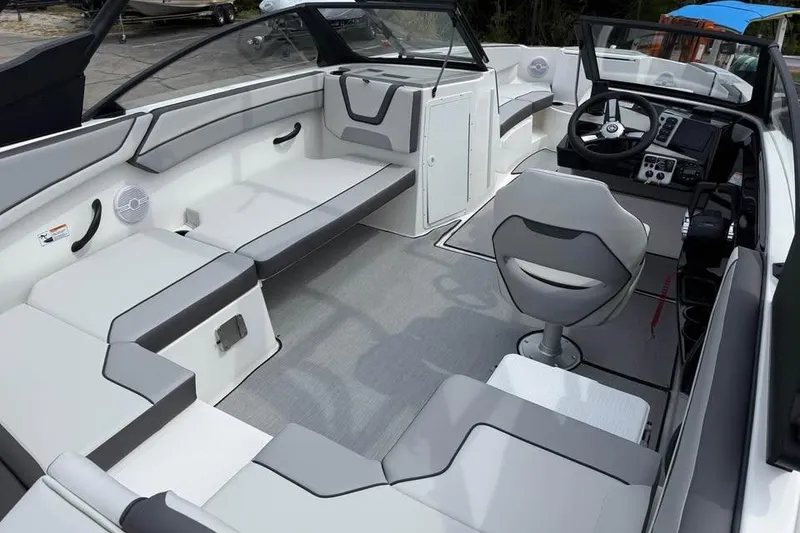 Slide: The Image of 2026 Yamaha Boats AR220 interior with modern seating and sleek dashboard design. - 8