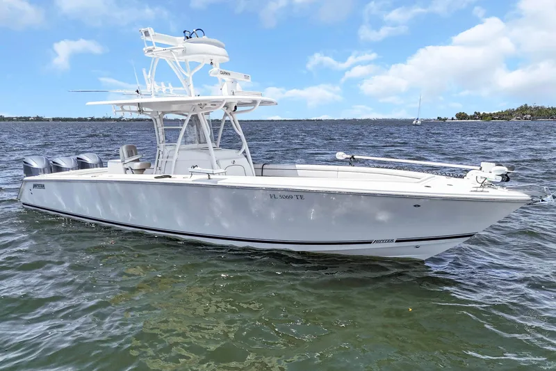 Slide: The Image of 2017 Jupiter 34 FS boat on water under blue sky. - 11
