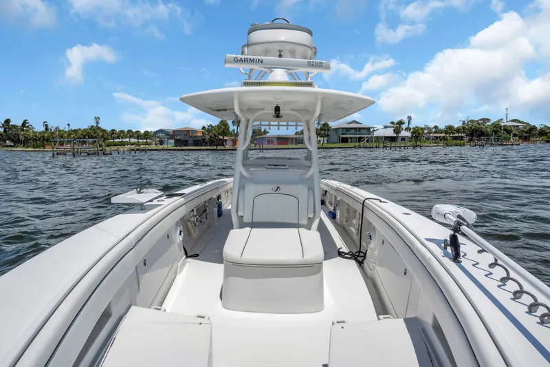 Slide: The Image of 2017 Jupiter 34 FS boat on water, featuring Garmin equipment, clear sky background. - 16