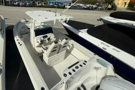 Slide: The Image of 2024 Sailfish 242 CC boat with dual seating and spacious deck layout. - 20