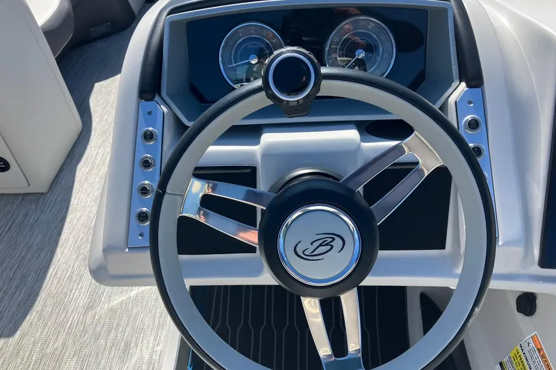 Slide: The Image of 2023 Barletta CORSA 25UE steering wheel and dashboard, featuring sleek design and modern controls. - 13