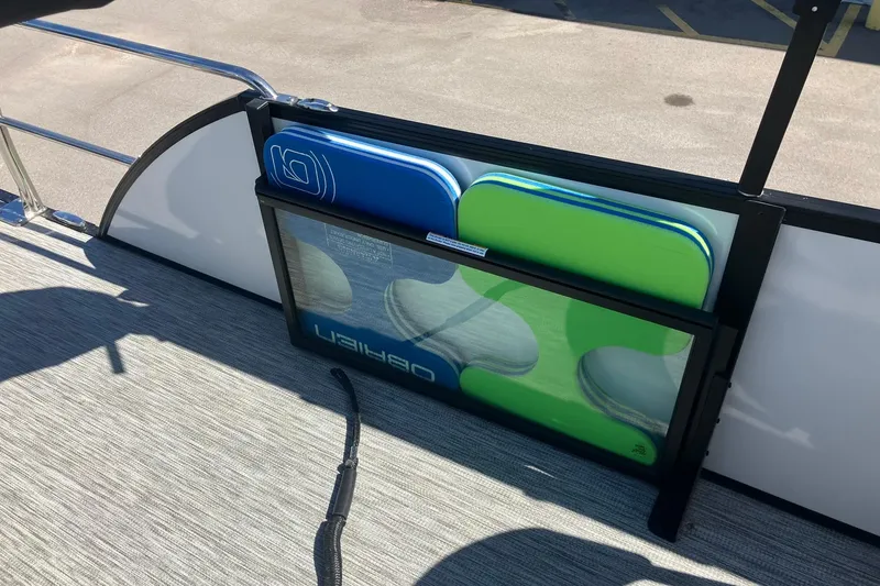 Slide: The Image of 2023 Barletta CORSA 25UE boat with colorful storage compartments on deck. - 16