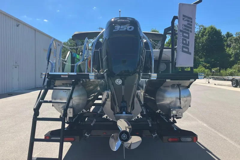 Slide: The Image of 2023 Barletta CORSA 25UE pontoon boat with powerful 350 engine, docked outdoors. - 3