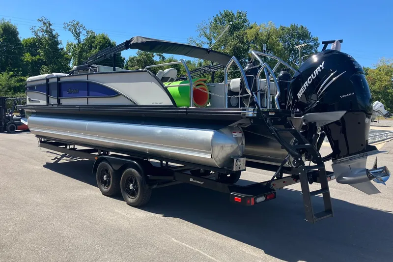 Slide: The Image of 2023 Barletta CORSA 25UE pontoon boat with Mercury engine on trailer. - 4