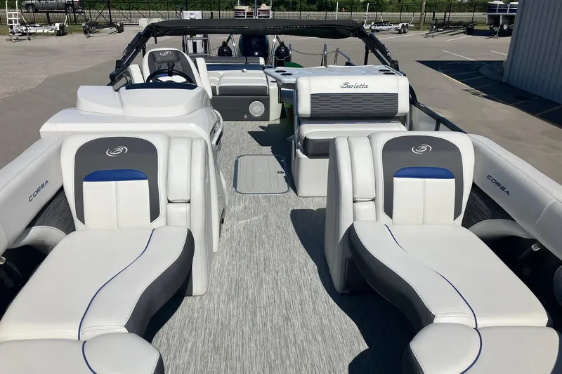 Slide: The Image of 2023 Barletta CORSA 25UE pontoon boat interior with luxurious seating and modern design. - 5