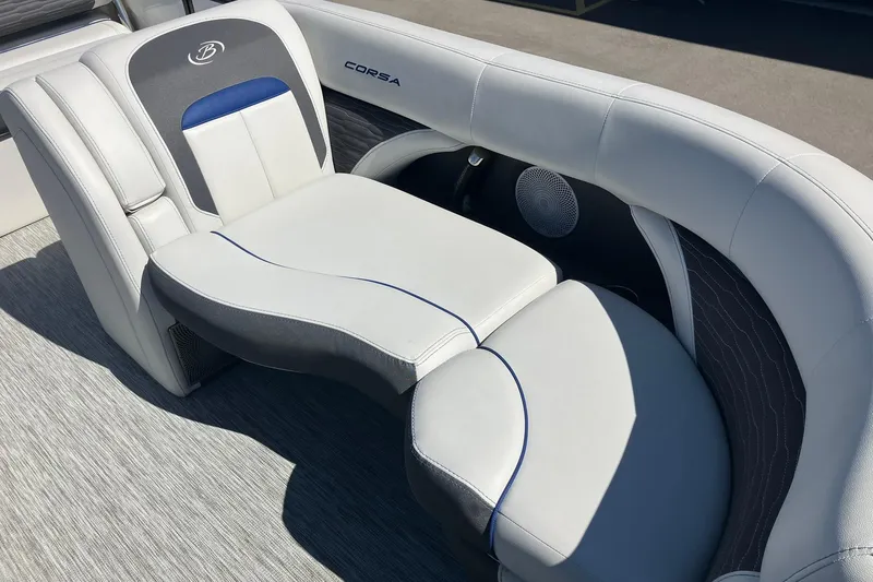 Slide: The Image of 2023 Barletta CORSA 25UE boat interior with luxurious white seating and speaker. - 7