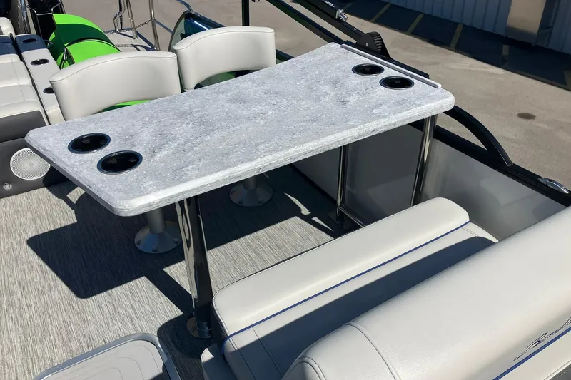 Slide: The Image of 2023 Barletta CORSA 25UE boat interior with table and seating arrangement. - 8