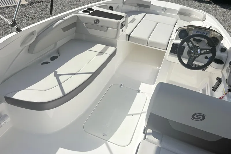 Slide: The Image of 2024 Hurricane SS boat interior with white seating and steering wheel. - 15