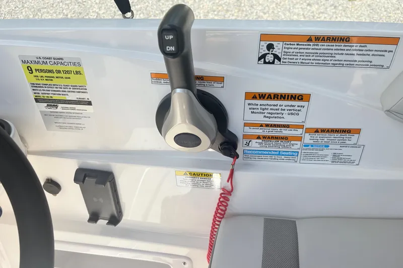 Slide: The Image of 2024 Hurricane SS boat control panel with safety warnings and capacity details. - 20