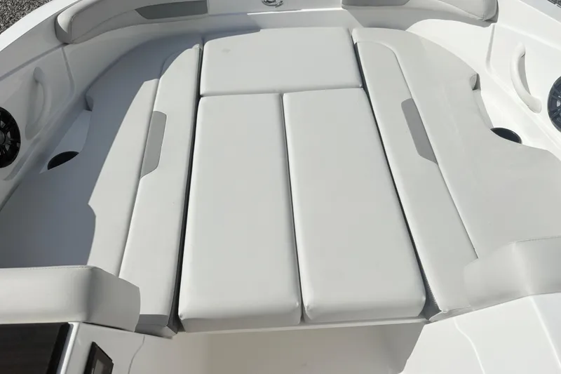 Slide: The Image of 2024 Hurricane SS boat interior with cushioned seating and sleek design. - 21