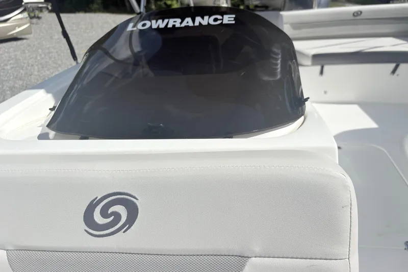 Slide: The Image of 2024 Hurricane SS boat interior with Lowrance equipment and stylish seating. - 25