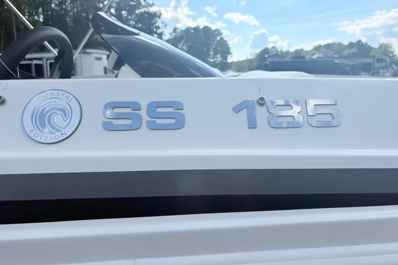 Slide: The Image of 2024 Hurricane SS 185 Coastal Edition boat with sleek design and logo. - 8