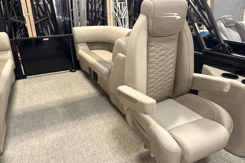 Slide: The Image of 2026 Bennington 22 SSRSE pontoon boat under construction in a factory setting. - 10