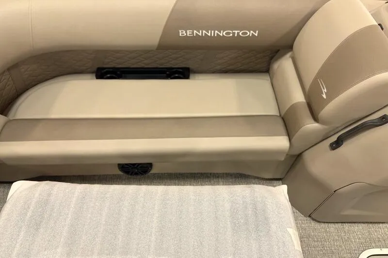 Slide: The Image of 2026 Bennington 22 SSRSE pontoon boat with black cover in a factory setting. - 12