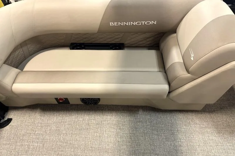 Slide: The Image of 2026 Bennington 22 SSRSE pontoon boat in a workshop, covered and equipped with accessories. - 13