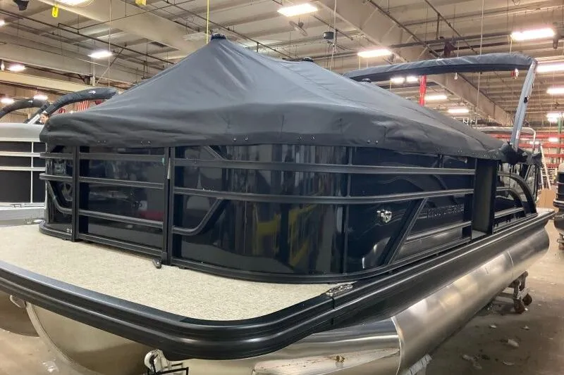 Slide: The Image of Storage compartment of 2026 Bennington 22 SSRSE boat, open with contents inside. - 16