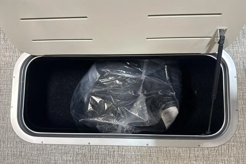 Slide: The Image of 2026 Bennington 22 SSRSE boat interior with beige seating and logo. - 18