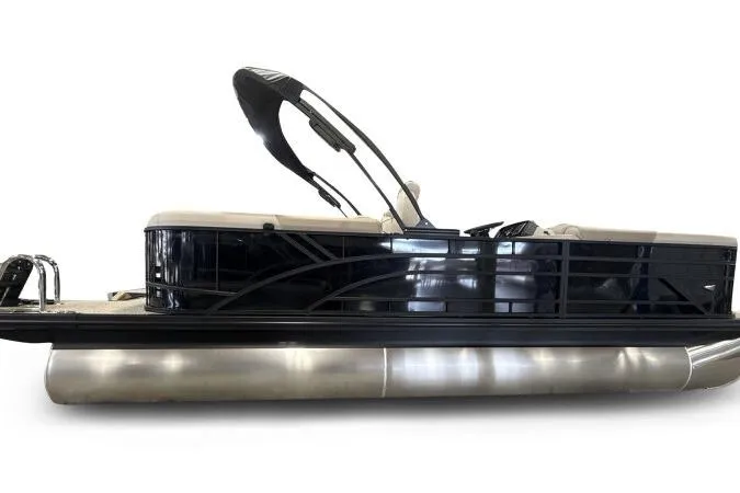 The Image of 2026 Bennington 22 SSRSE pontoon boat with sleek black railing and modern design. - 2