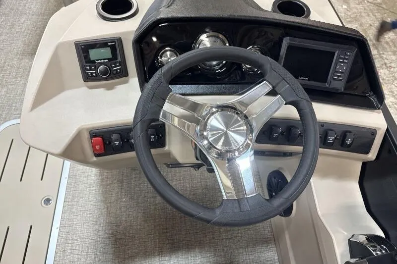 Slide: The Image of Steering console of 2026 Bennington 22 SSRSE boat with modern controls and gauges. - 21