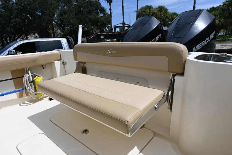Slide: The Image of 2021 Scout 255 LXF boat with beige seating and dual Mercury engines. - 11