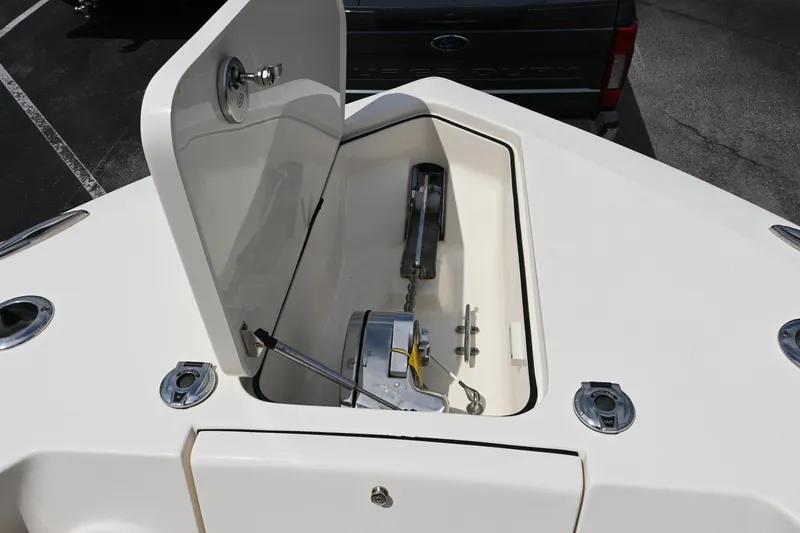 Slide: The Image of 2021 Scout 255 LXF boat anchor compartment with open hatch. - 17