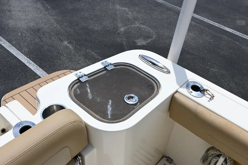 Slide: The Image of 2021 Scout 255 LXF boat interior with livewell and seating area. - 19