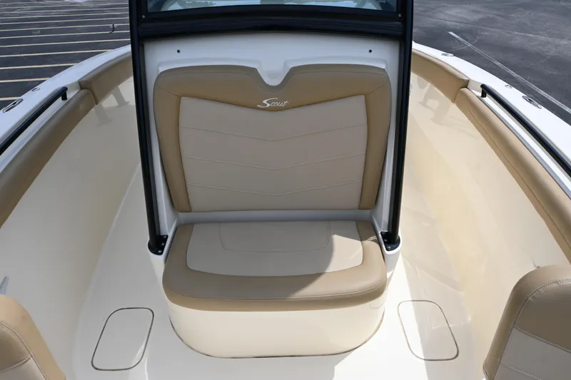 Slide: The Image of 2021 Scout 255 LXF boat interior with tan seating and sleek design. - 5