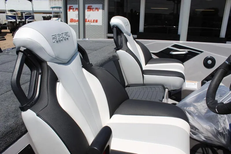 Slide: The Image of 2026 Skeeter FXR20 FLEX boat seats, black and white design, at Fun N Sun Boat Sales. - 11