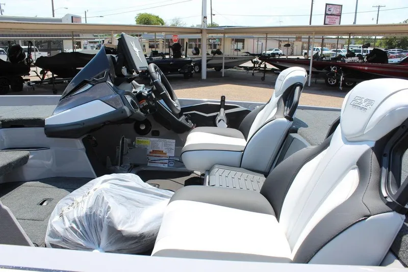 Slide: The Image of 2026 Skeeter FXR20 FLEX boat interior with modern dashboard and comfortable seating. - 14
