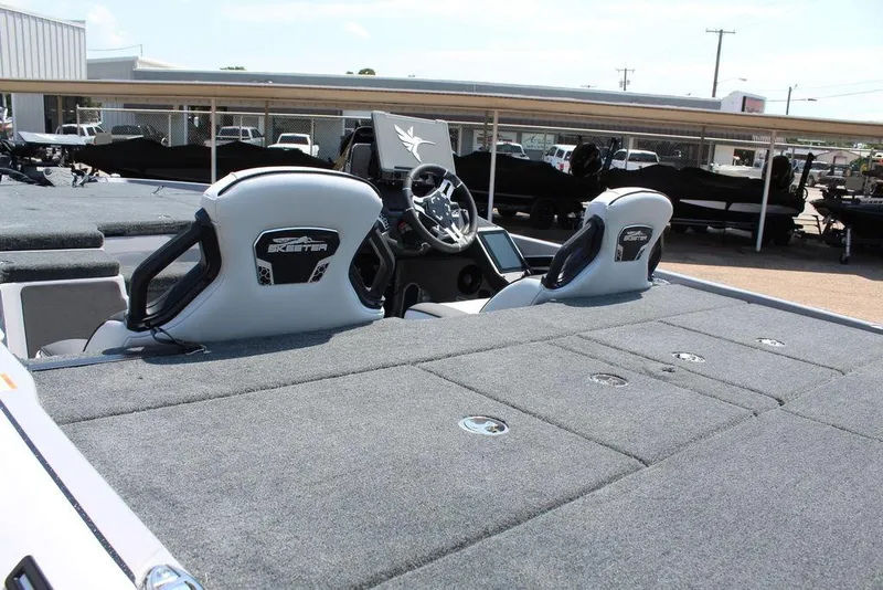 Slide: The Image of 2026 Skeeter FXR20 FLEX boat interior with dual seats and modern dashboard. - 9