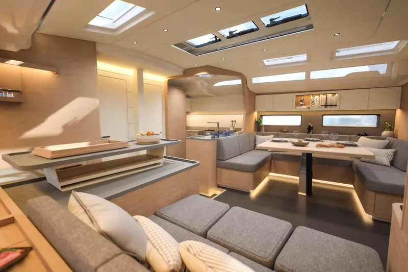 Slide: The Image of Luxurious interior of 2026 Dufour 54 yacht with modern dining and seating area. - 17