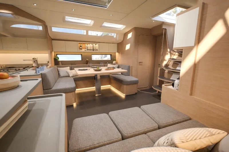 Slide: The Image of Luxurious interior of 2026 Dufour 54 yacht with modern seating and dining area. - 27