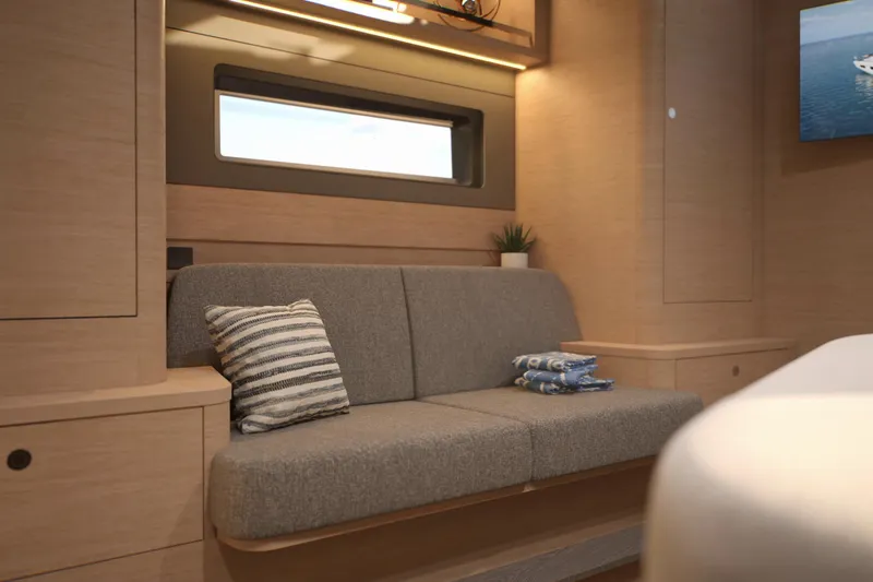 Slide: The Image of Luxurious interior of 2026 Dufour 54 yacht with modern sofa and decor. - 7