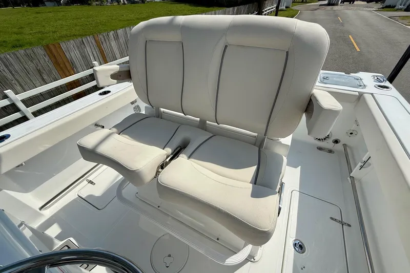 Slide: The Image of 2026 Sea Hunt Gamefish 25 boat seating, featuring comfortable dual captain's chairs. - 10