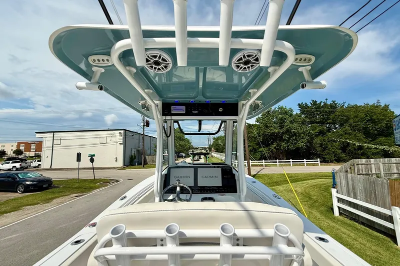 Slide: The Image of 2026 Sea Hunt Gamefish 25 boat with advanced Garmin navigation system and rod holders. - 12