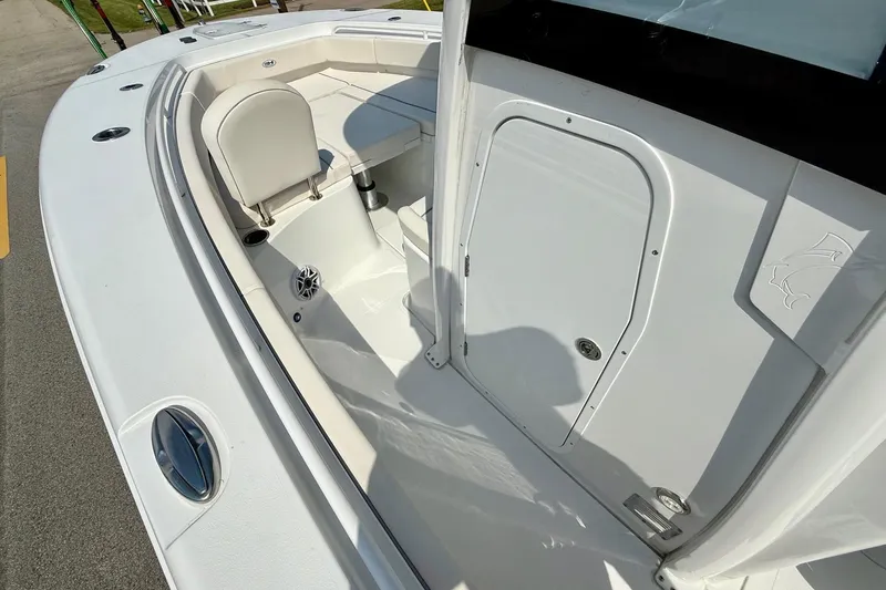 Slide: The Image of 2026 Sea Hunt Gamefish 25 boat interior, featuring seating and storage compartments. - 13